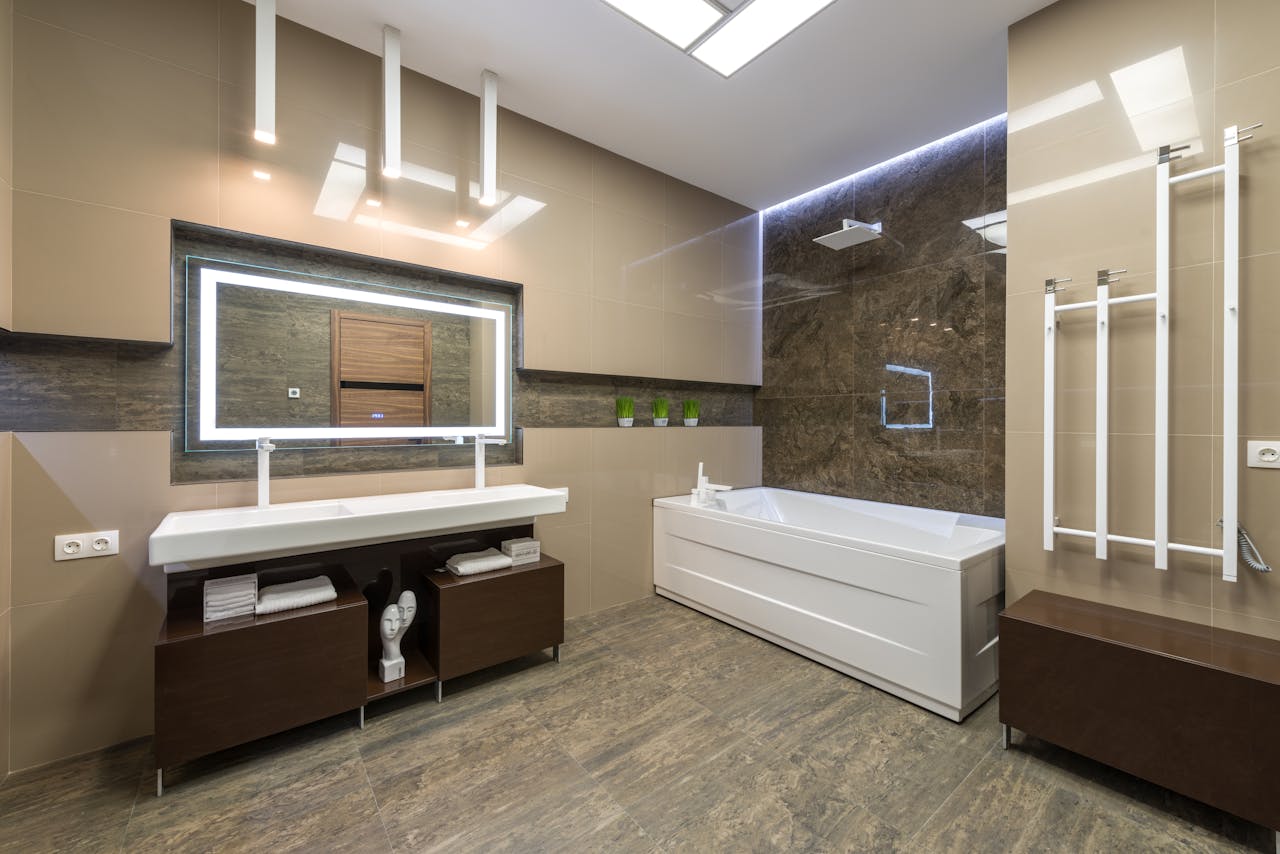 Contemporary bathroom showcasing elegant fixtures, spacious layout, and stylish lighting.